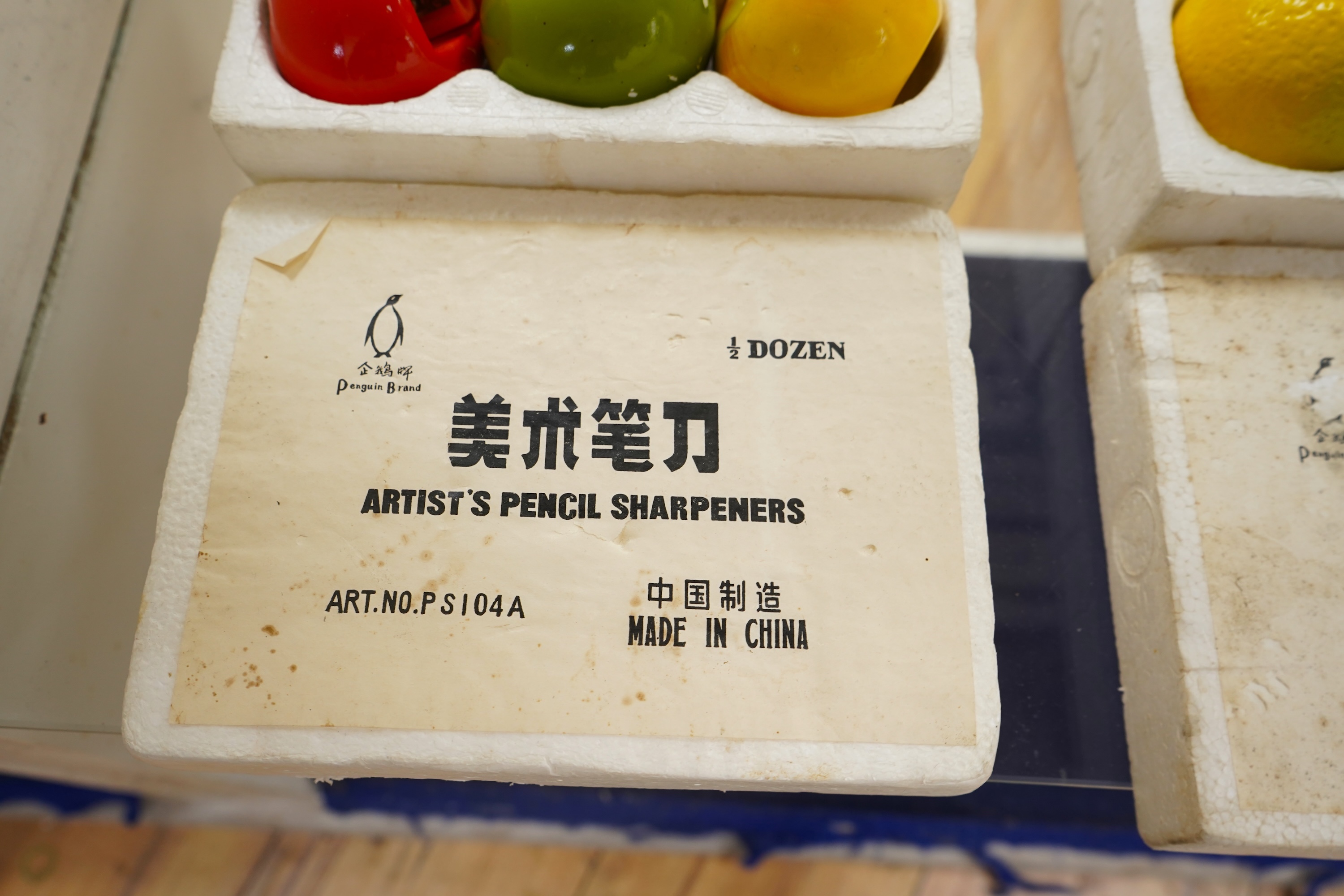 Two boxed sets of novelty Chinese Penguin Brand pencil sharpeners in the form of fruit